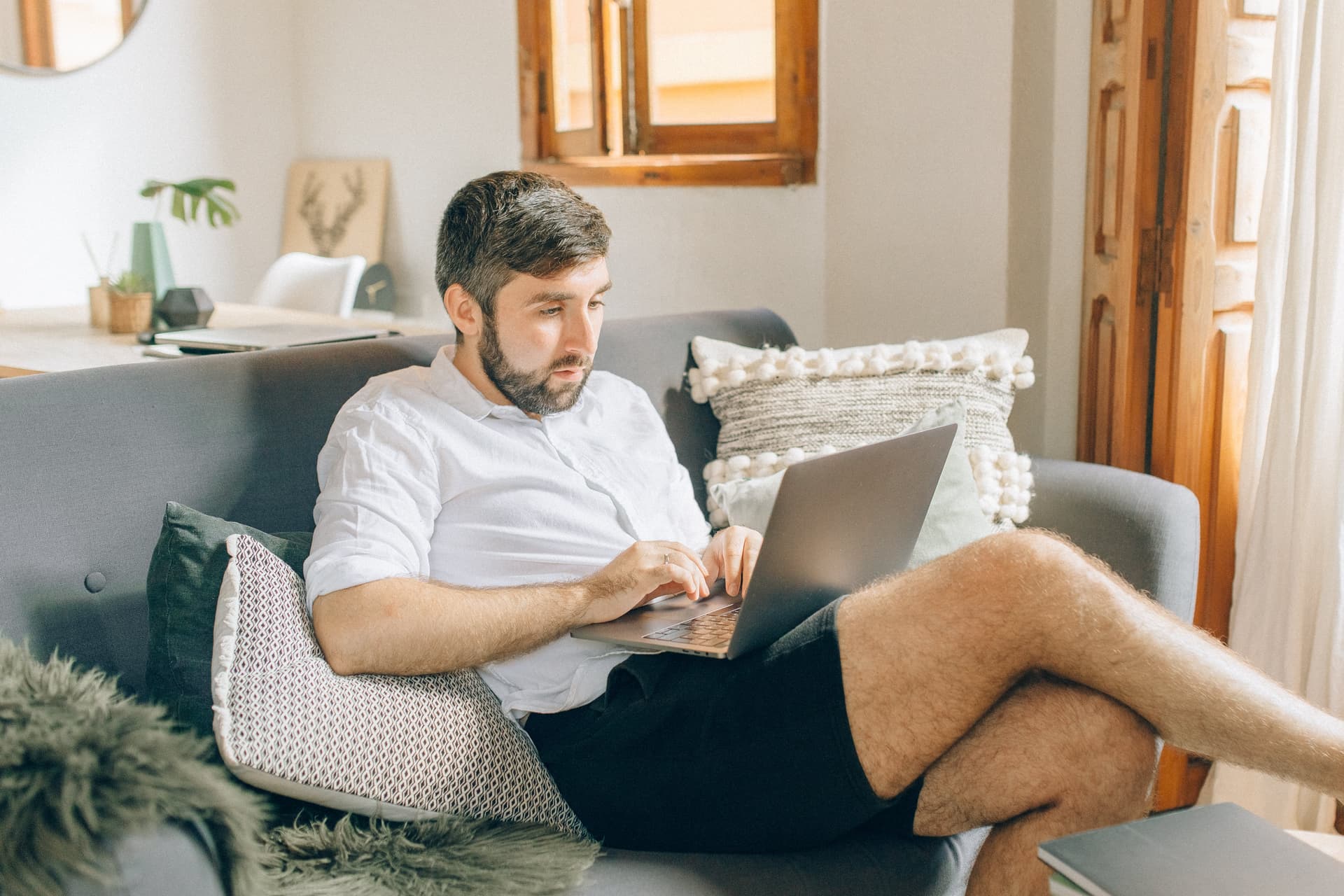 Photo of a man working on a couch